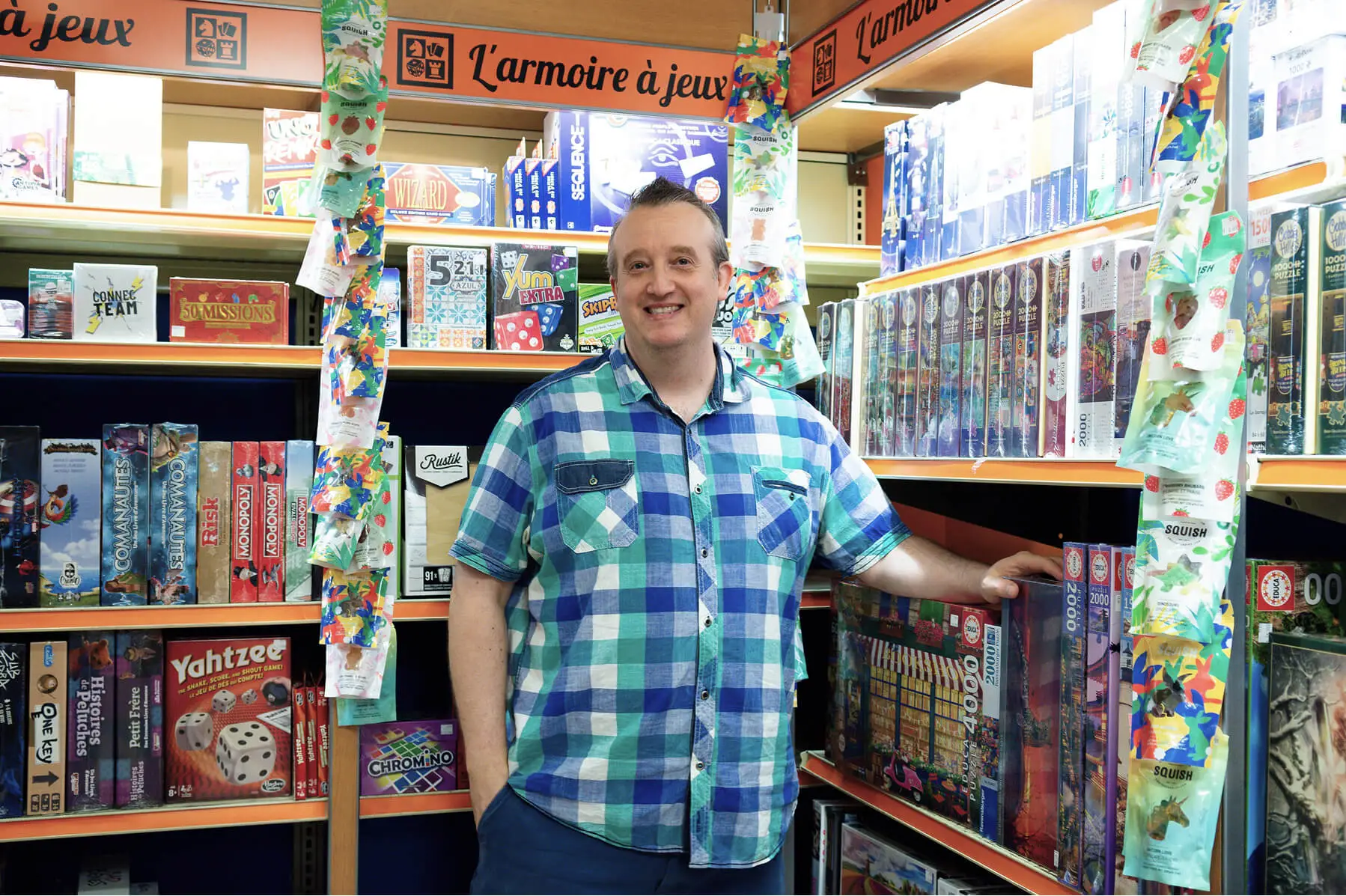 Smiling man in a board game store