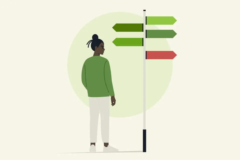 Person facing signpost with green and red arrows